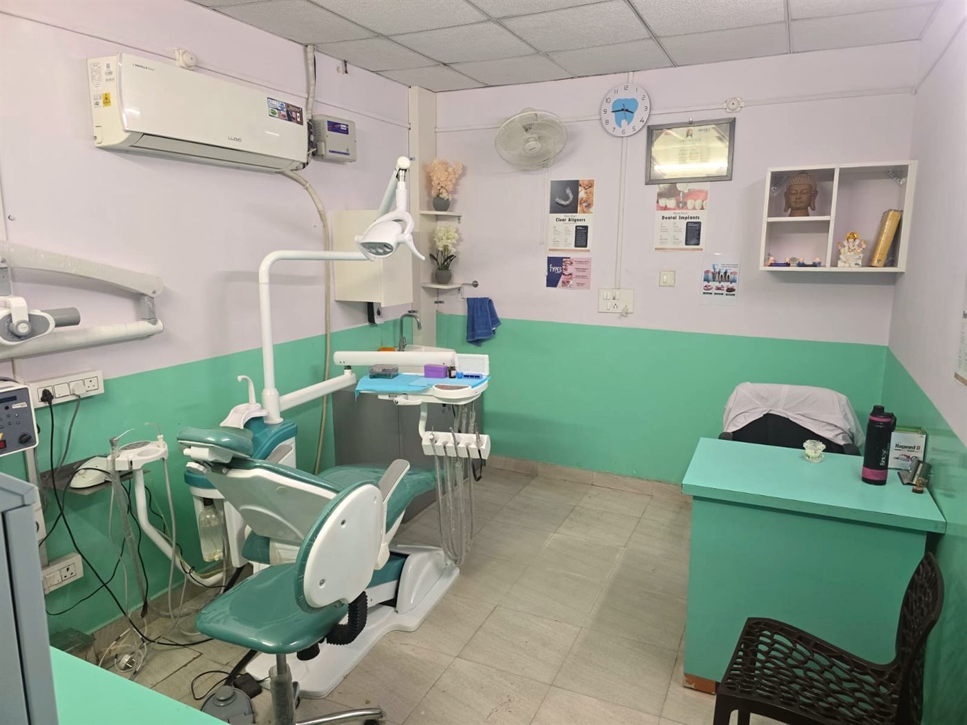 Treatment room at Swastik Smile Care with dental chair and consultation desk